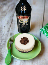 Load image into Gallery viewer, Bailey’s Irish Cream Cheesecake with whipped chocolate ganache
