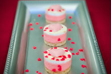 Load image into Gallery viewer, Tw inch mini mini pink cheesecakes on a silver tray.